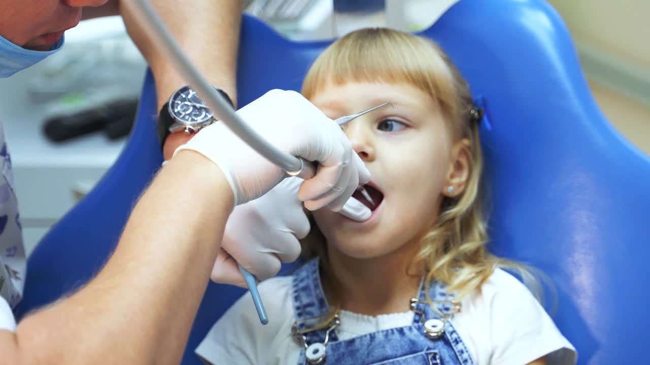 little girl at the dentist's appointment. Dental treatment in the hospital