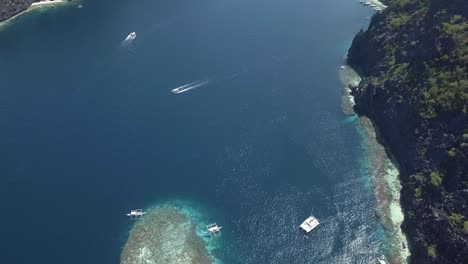 4K-Aerial-View-of-Beautiful-Beach,-Ocean,-and-Islands-in-Tropical-Destination-El-Nido,-Palawan,-Philippines