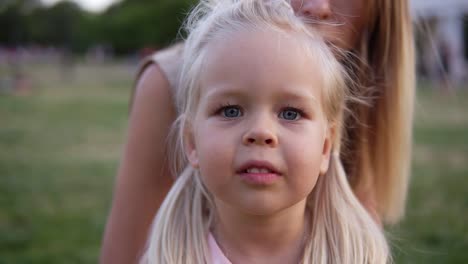 Portrait-Little-Young-Girl-With-Blue-Eyes-Looking-At-Camera