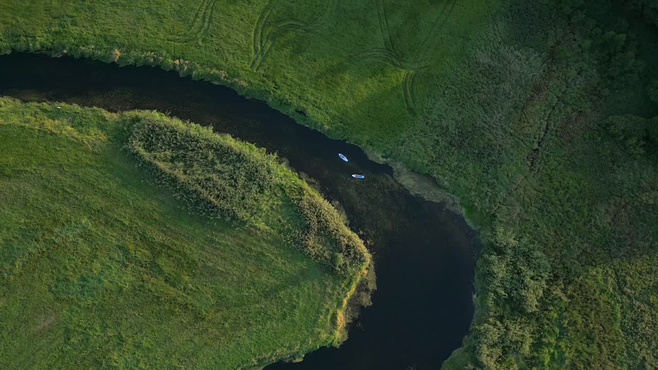 Aerial View of Kayakers on a Winding River