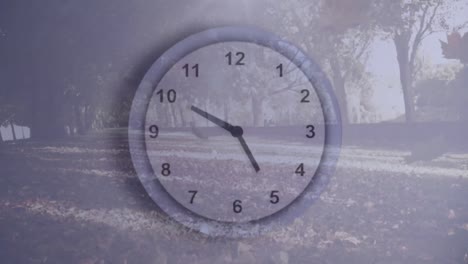 Animation-of-clock-moving-over-leaves-falling-in-park