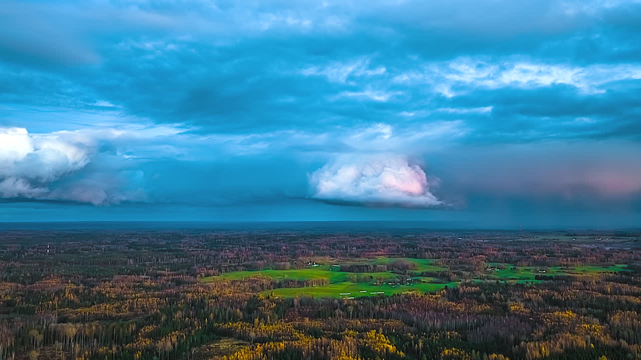 Time-lapse storm clouds moving over a landscape in Latvia rural countryside