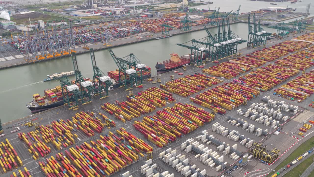 Logistics port terminal with containers and vessels, drone perspective