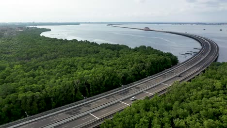 south exit of mandara toll road and gerbang tol house midway in bali indonesia, aerial dolly right shot