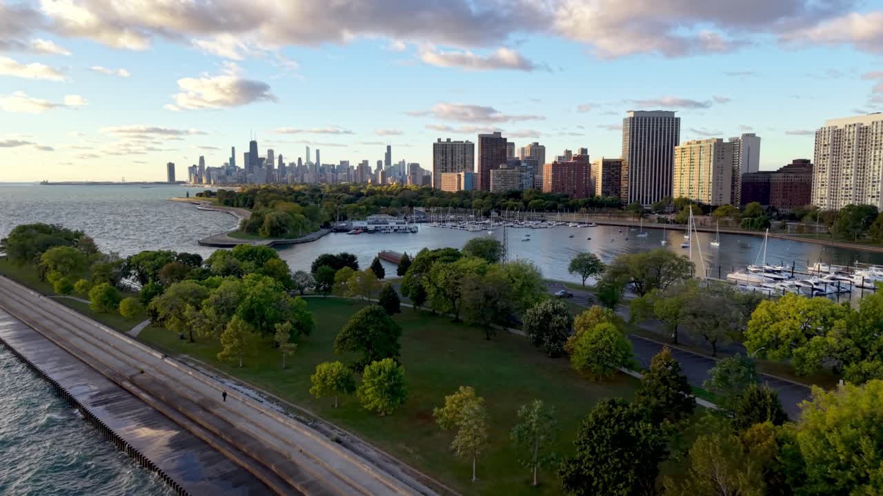 Waves crash against shoreline with Chicago Illinois Skyline in background