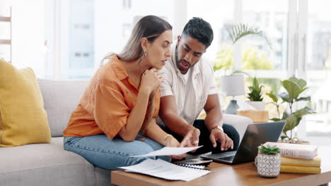 Couple,-laptop-and-calculate-bills-for-budget