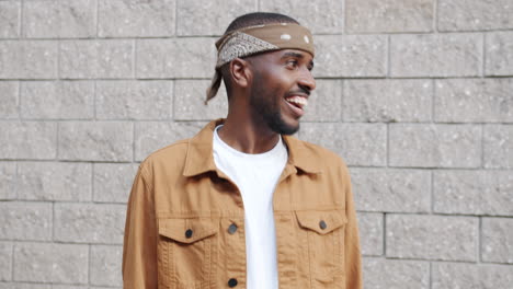 smiling man in urban outfit