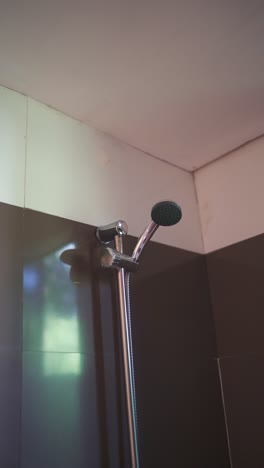 close-up of a modern chrome shower head in a bathroom
