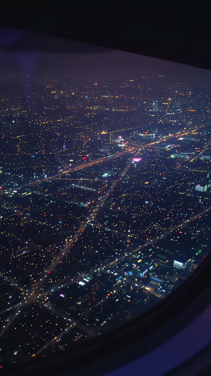 Vertical video: Cruising over city, plane showing grid via rim, showing magenta junction for cabin