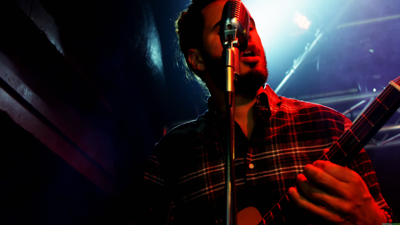 Guitarist playing guitar on stage 4k