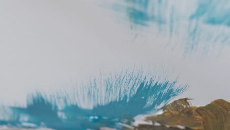 the artist prepares the paints for writing the nartina an artist works on an abstract oil painting - the artist prepares the paints for writing the nartina. an artist works on an abstract oil painting in a workshop. the concept of painting a picture