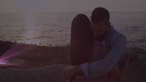animación de puntos de luz sobre diversas parejas que se abrazan