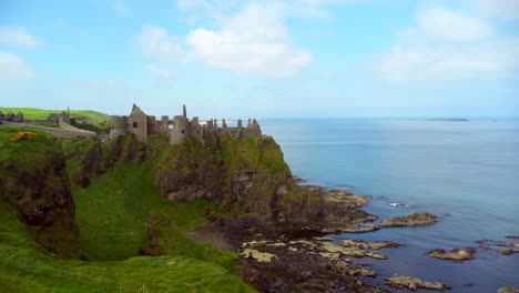 Aerial-shot-of-Dunluce-Castle,-in-Bushmills-on-the-North-County-Antrim-coast-in-Northern-Ireland