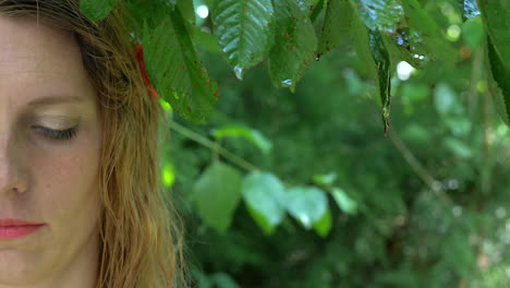 beautiful woman posing in tropical rainy scenery