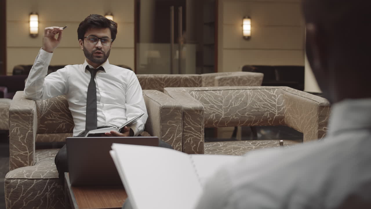 Entrepreneur Having Meeting with Contractor