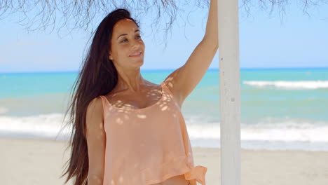 Pretty-Lady-Holding-at-the-Beach-Umbrella-Stand