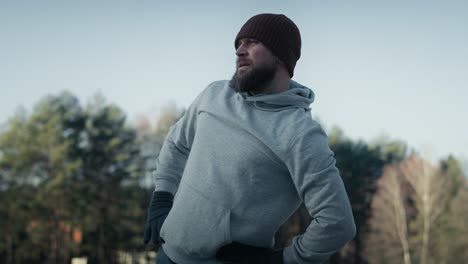 adult caucasian man warming up before winter swimming.