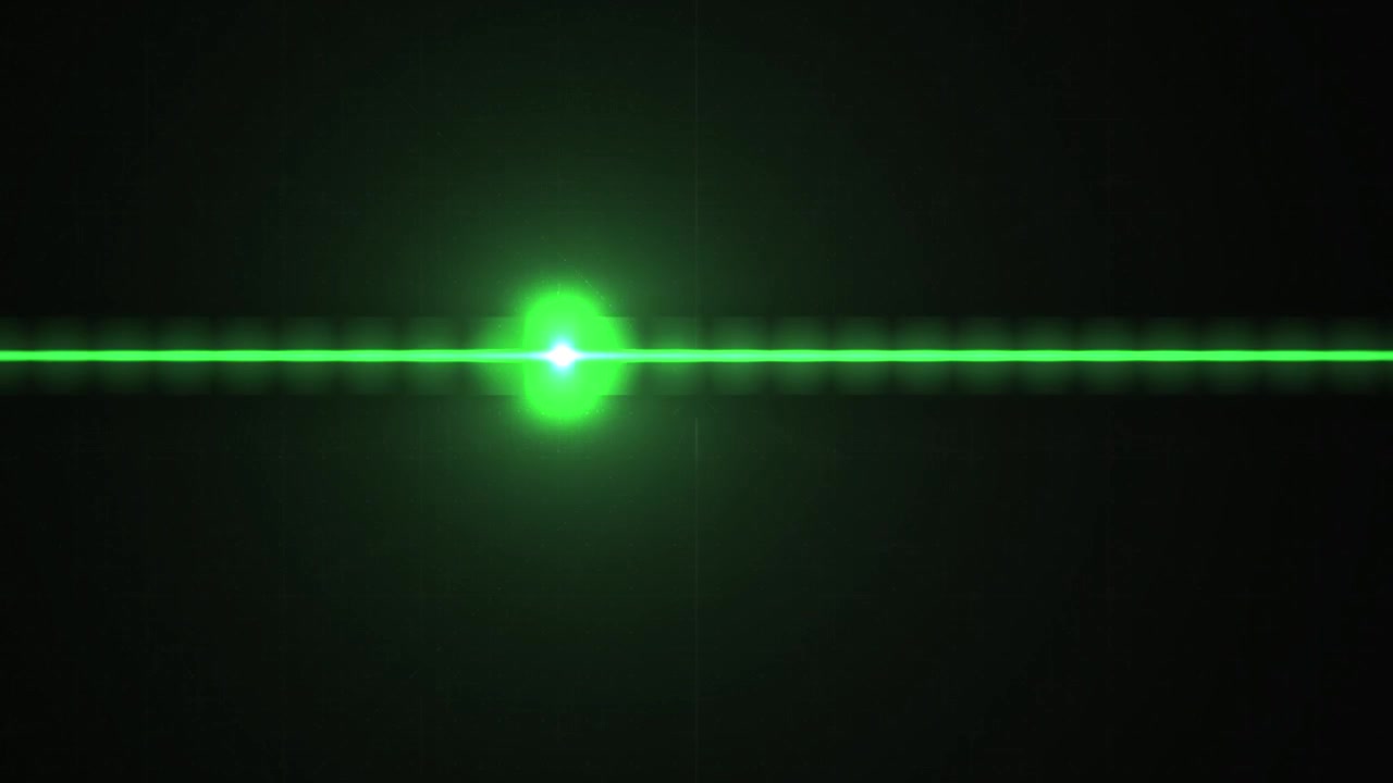 Scansione di un raggio laser verde su sfondo scuro