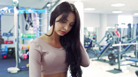 woman running on treadmill. side view of attractive sport woman on running track