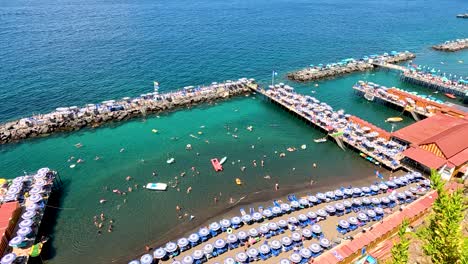 tourists enjoying the beach and sea