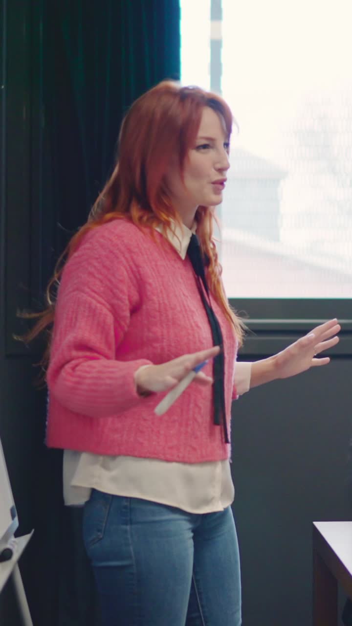 Coworkers applauding and congratulate a woman after a speech