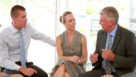 business people speaking together in office