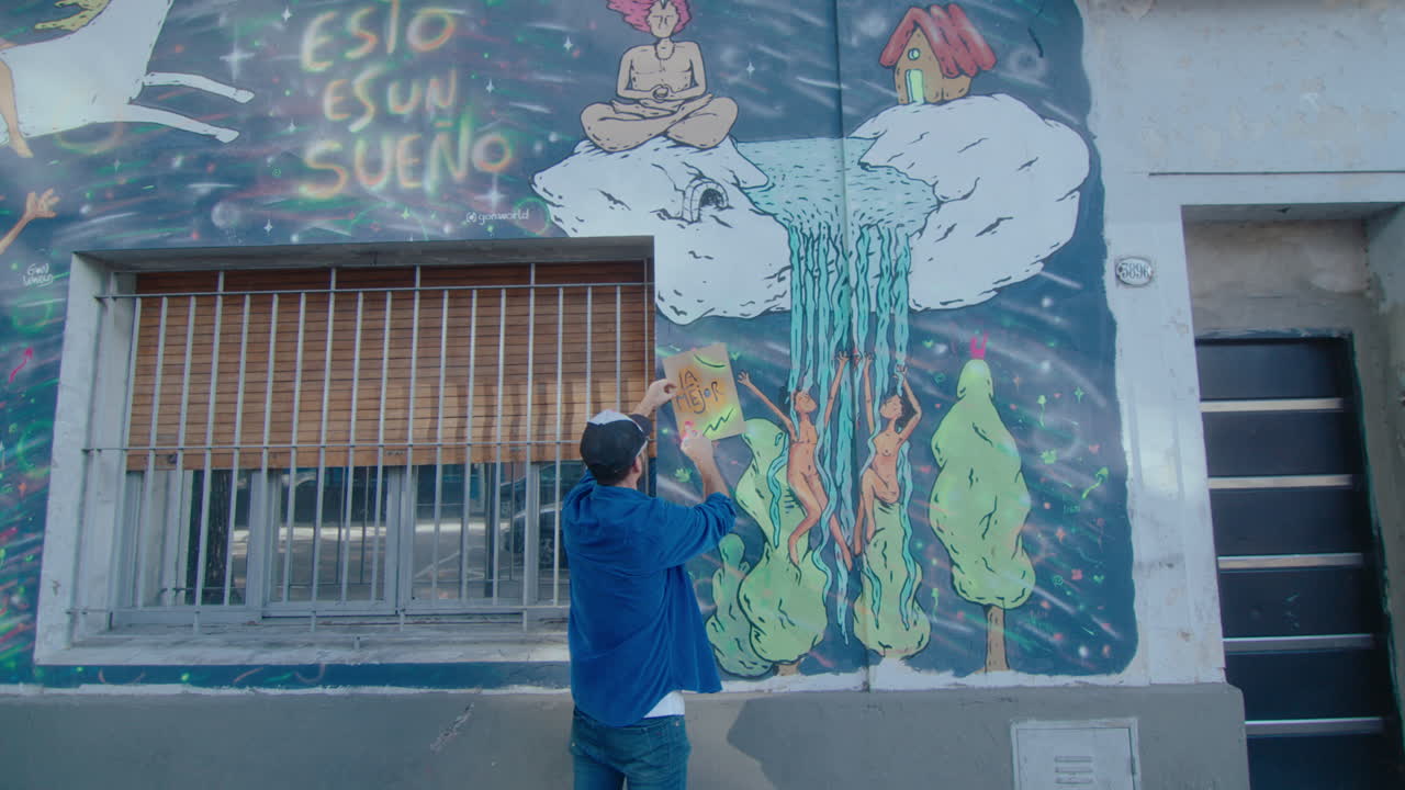 Street Artist Drawing Surreal Graffiti Outdoors in the City