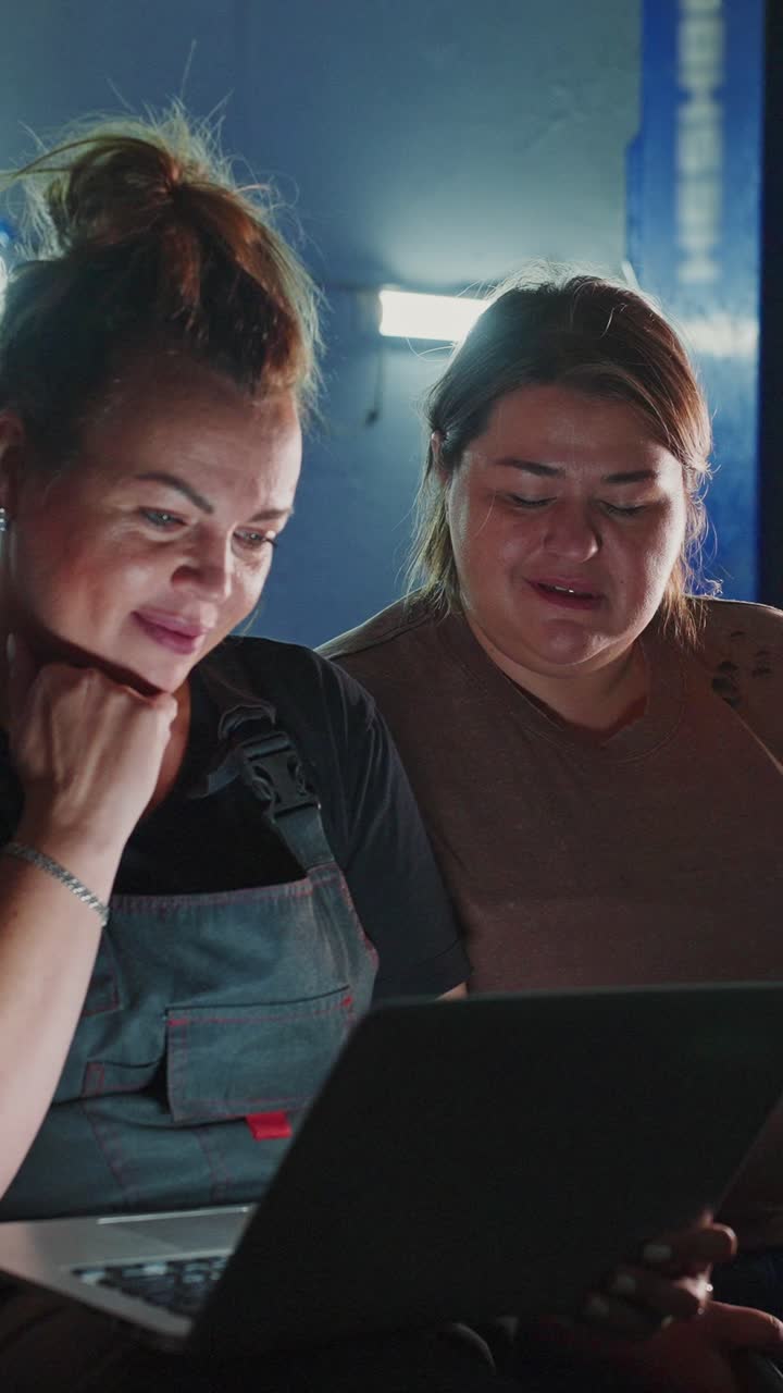 Two Women Working Together on a Laptop