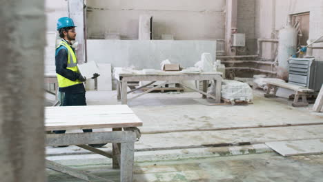 man carrying marble