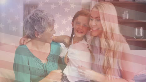 Animation-of-flag-of-usa-over-caucasian-female-couple-and-daughter