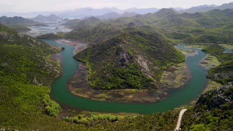 Pavlova-Strana-Viewpoint-and-Crnojevica-river-at-Skadar-Lake,-Montenegro---Slow-Aerial