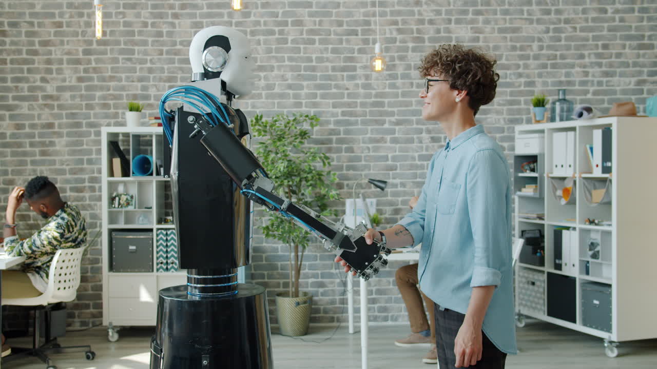 Robot and Woman Shaking Hands in Modern Office