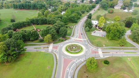 aerial rising tilt down drone shot of a traffic circle roundabout in hershey, pennsylvania