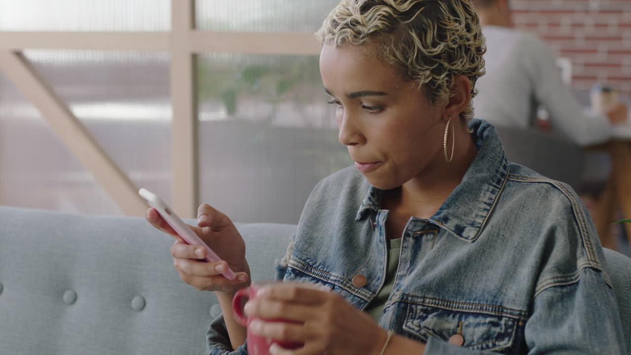 beautiful african american business woman using smartphone browsing social media messages texting sharing successful career ideas networking on mobile phone in modern office workplace