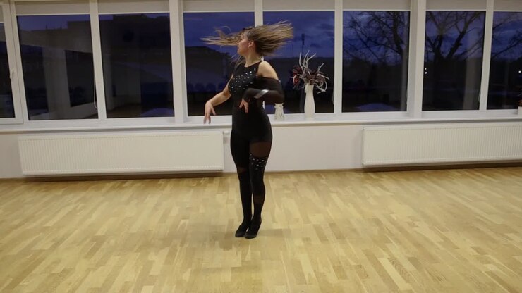 Professional and passionate female dancer dances on the dance floor slow motion