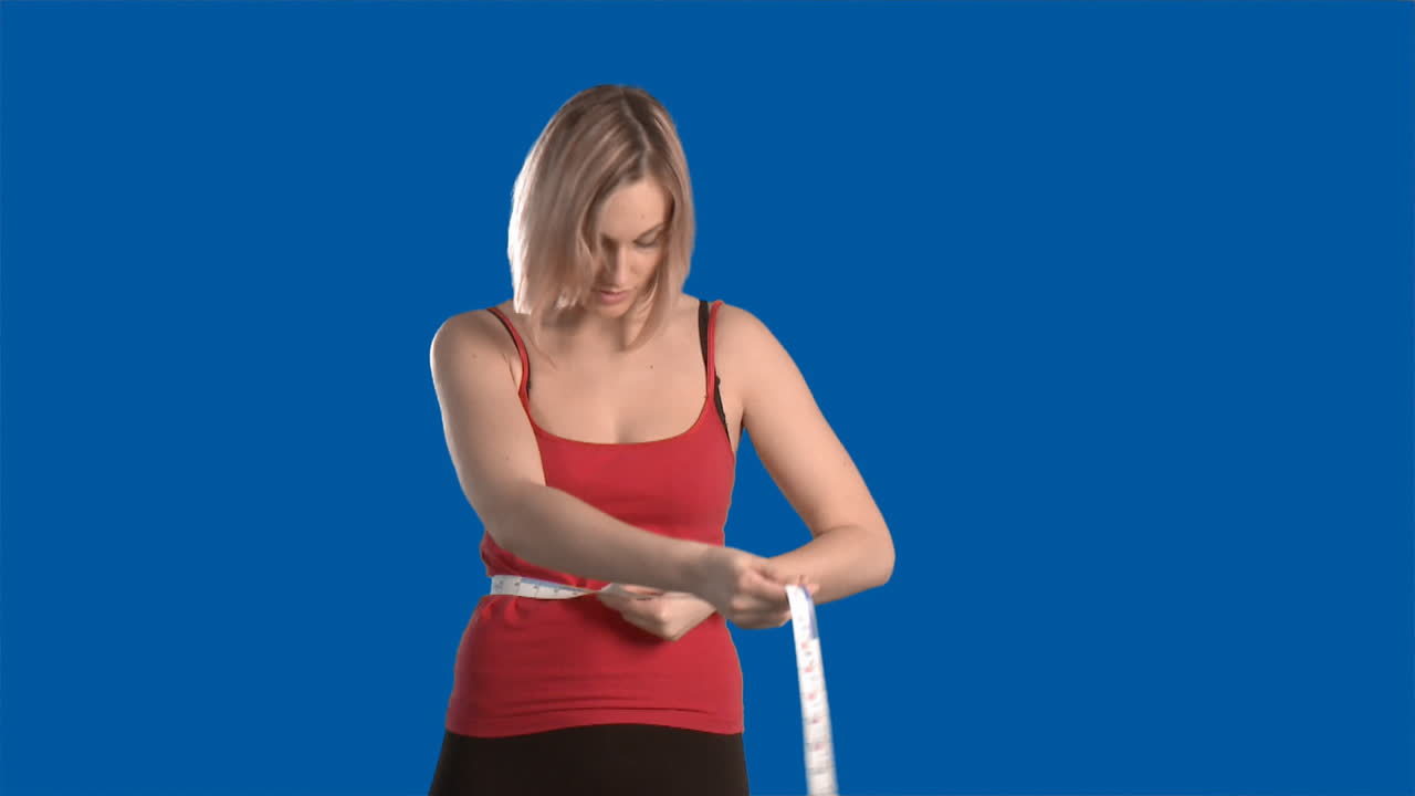 Woman measuring herself