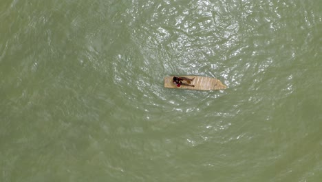Aerial-shot-of-a-boat-or-canoe-fishing-in-a-sea-during-the-day_6