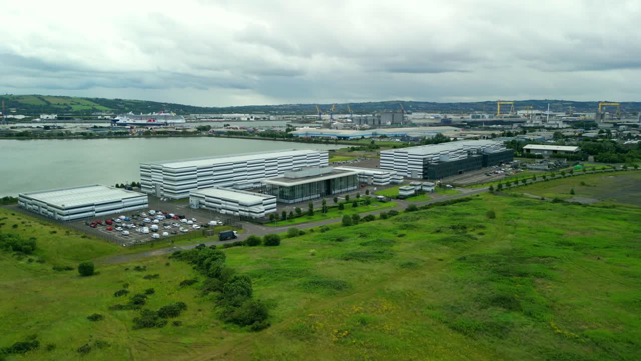 Slow rotating wide aerial video GV of Studio Ulster, a virtual production film studio in Belfast, Northern Ireland. Filmed in 4K, 30FPS and with Rec709 color