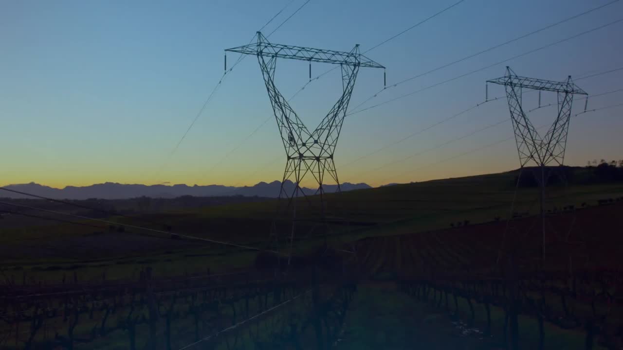 Animation of glowing globe over electricity pylons