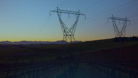 Animation-of-glowing-globe-over-electricity-pylons