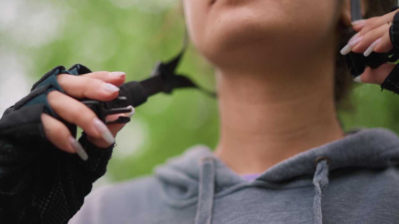 Forested Scene With Rider Preparing To Cycle, Rider In Hoodie Fastening Helmet Before Mountain Biking Begins, Focused Cyclist With Protective Gear Ready To Tackle Rough Forest Trail On Daybreak