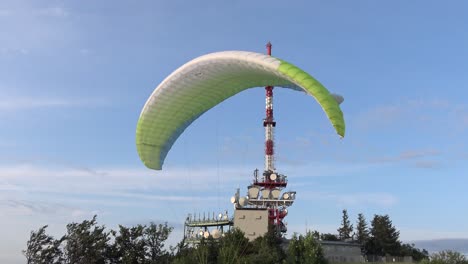 A-paraglider-preparing-to-launch-on-top-of-a-mountain-in-Austria