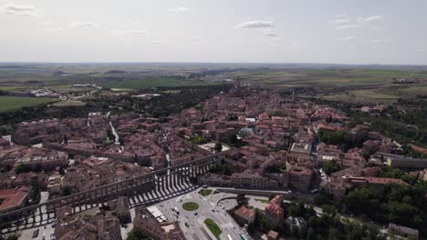 aerial view circling segovia city aqueduct and la latina neighbourhood, north west madrid, spain city landscape