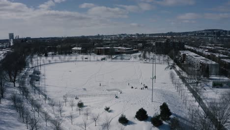 4k winter sleighride sliding hills - drone - fast - towards park