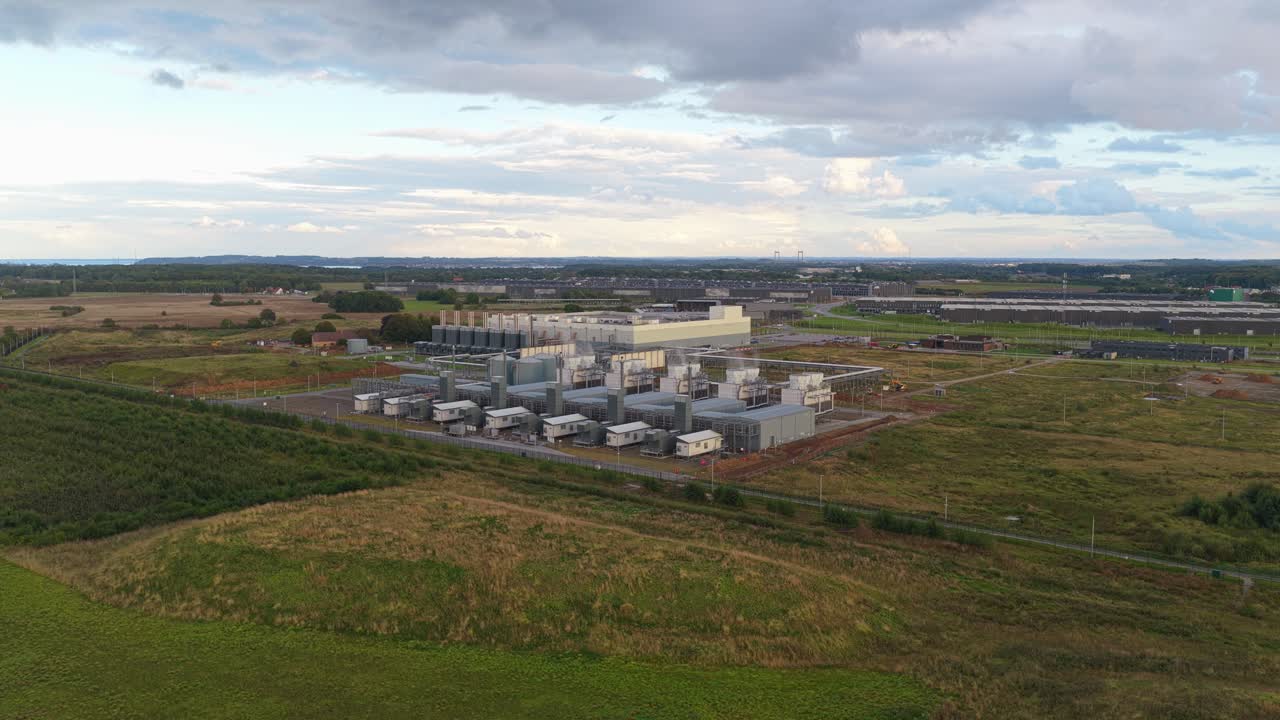 Aerial drone view of a modern secure data center in Denmark with business-critical IT servers, cloud computing systems, and artificial intelligence infrastructure