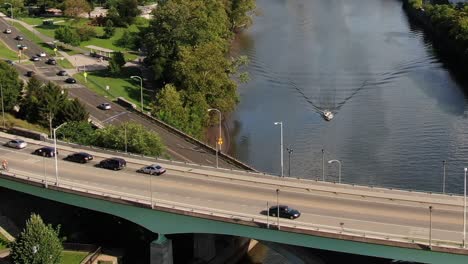 car driving over the spring garden bridge over the schuylkill river with the boat