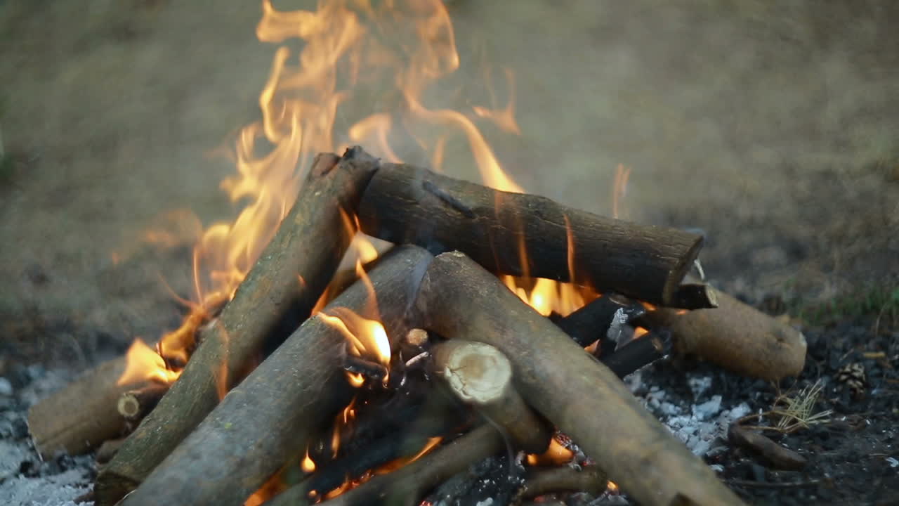 Close Up Of Big Outdoor Bonfire. Close up shot of a fire and firewood burning in outdoor