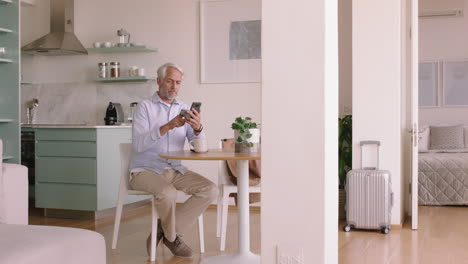 mature man using smartphone shopping online spending money on credit card mobile banking app with digital currency