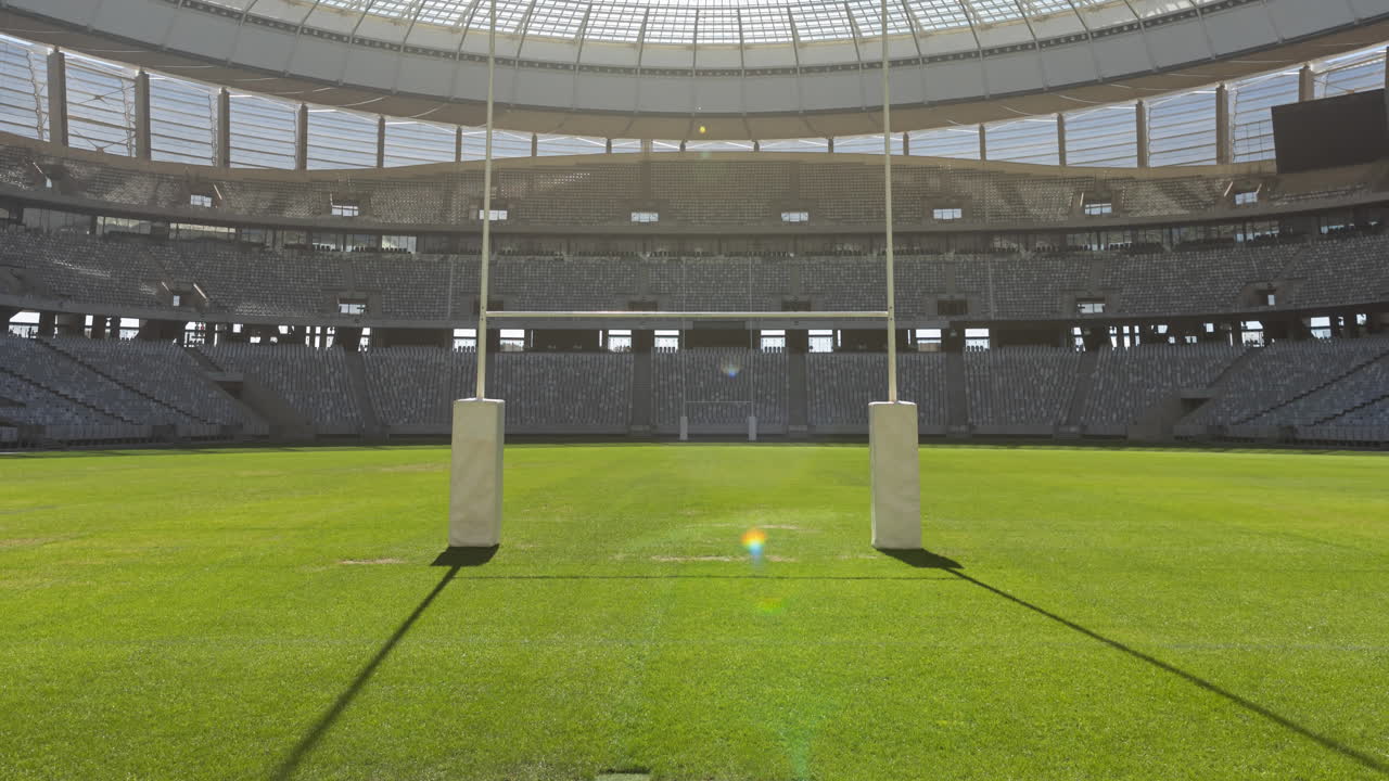 スポーツスタジアムのラグビーピッチで空のスタンドのアニメーション