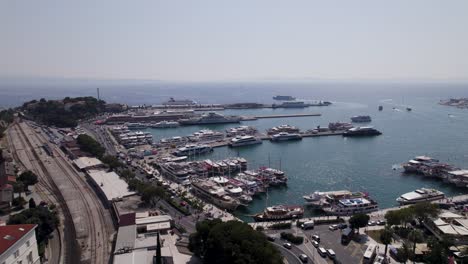 aerial - split, croatia: bustling harbor, docked boats, vibrant cityscape